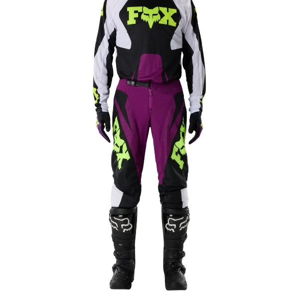 Fox Racing 180 Raid Pants in Purple Lava, close-up of the side thigh and knee panels, with the ratcheting waist adjuster, stretch yoke, shaped hip panel, and reinforced knee or thigh material. Available options—Color: Rust, Purple Lava, Deep Fern; Size: 28, 30, 32, 34, 36, 38. SKU 40685-E07-36. UPC 198571129326.