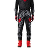 Fox Racing 180 Abyss Pants in Black, close-up of the side thigh and knee panels, with the ratcheting waist adjuster, stretch yoke, shaped hip panel, and reinforced knee or thigh material. Available options—Color: Black; Size: 26, 28, 30, 32, 34, 36, 38. SKU 40686-001-34. UPC 198571122365.