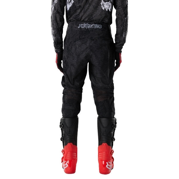 Fox Racing 180 Abyss Pants in Black, rear lower-leg and cuff view, with the reinforced seat, rear yoke, articulated knees, tapered legs, and lower-leg graphics. Available options—Color: Black; Size: 26, 28, 30, 32, 34, 36, 38. SKU 40686-001-36. UPC 198571122372.
