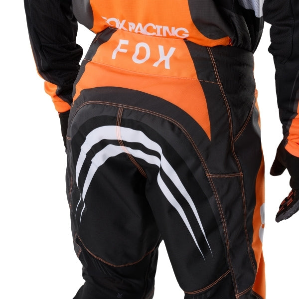 Fox Racing 180 Draft Pants in Sunburst, close-up of the ratcheting waist closure, with the ratcheting waist adjuster, stretch yoke, shaped hip panel, and reinforced knee or thigh material. Available options—Color: White, Black, Sunburst; Size: 28, 30, 32, 34, 36, 38. SKU 40687-460-34. UPC 198571131657.