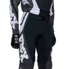 Fox Racing Flexair Thorn Pants in Black/White, close-up of the waist and hip panels, with the ratcheting waist adjuster, stretch yoke, shaped hip panel, and reinforced knee or thigh material. Available options—Color: Black/White, Purple Lava, Red; Size: 28, 30, 32, 34, 36, 38. SKU 40688-018-32. UPC 198571123799.