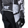 Fox Racing Flexair Thorn Pants in Black/White, close-up of the ratcheting waist closure, with the ratcheting waist adjuster, stretch yoke, shaped hip panel, and reinforced knee or thigh material. Available options—Color: Black/White, Purple Lava, Red; Size: 28, 30, 32, 34, 36, 38. SKU 40688-018-34. UPC 198571123805.