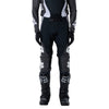 Fox Racing Flexair Thorn Pants in Black/White, close-up of the side thigh and knee panels, with the ratcheting waist adjuster, stretch yoke, shaped hip panel, and reinforced knee or thigh material. Available options—Color: Black/White, Purple Lava, Red; Size: 28, 30, 32, 34, 36, 38. SKU 40688-018-36. UPC 198571123812.