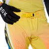 Fox Racing Flexair Arc Pants in Yellow, close-up of the waist and hip panels, with the ratcheting waist adjuster, stretch yoke, shaped hip panel, and reinforced knee or thigh material. Available options—Color: Yellow, Ice Blue, Chili; Size: 28, 30, 32, 34, 36, 38. SKU 40689-005-32. UPC 198571132913.