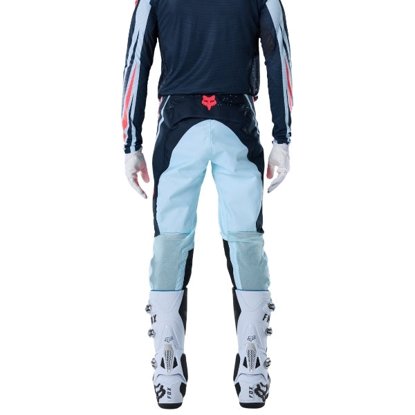 Fox Racing Flexair Arc Pants in Ice Blue, rear lower-leg and cuff view, with the reinforced seat, rear yoke, articulated knees, tapered legs, and lower-leg graphics. Available options—Color: Yellow, Ice Blue, Chili; Size: 28, 30, 32, 34, 36, 38. SKU 40689-231-38. UPC 198571126530.