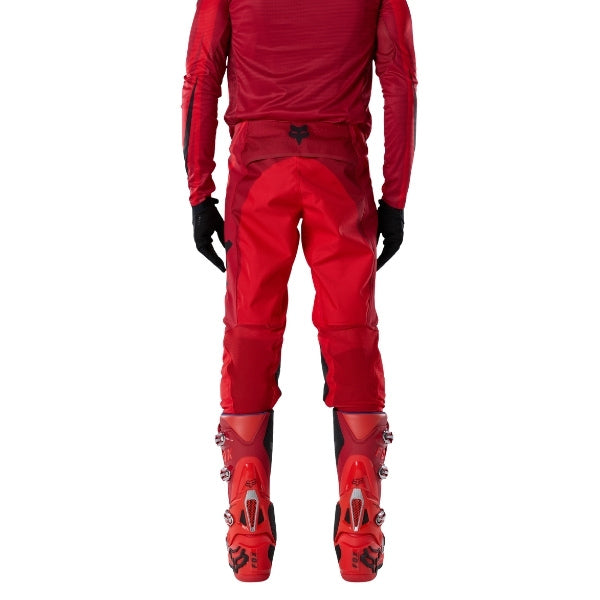 Fox Racing Flexair Arc Pants in Chili, rear lower-leg and cuff view, with the reinforced seat, rear yoke, articulated knees, tapered legs, and lower-leg graphics. Available options—Color: Yellow, Ice Blue, Chili; Size: 28, 30, 32, 34, 36, 38. SKU 40689-555-38. UPC 198571124482.
