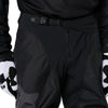 Fox Racing 180 Blackout Pants in Black, close-up of the waist and hip panels, with the ratcheting waist adjuster, stretch yoke, shaped hip panel, and reinforced knee or thigh material. Available options—Color: Black; Size: 26, 28, 30, 32, 34, 36, 38, 40, 42, 44. SKU 40693-001-30. UPC 198571121948.