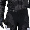 Fox Racing 180 BNKR Pants in Black Camo, close-up of the waist and hip panels, with the ratcheting waist adjuster, stretch yoke, shaped hip panel, and reinforced knee or thigh material. Available options—Color: Black Camo; Size: 26, 28, 30, 32, 34, 36, 38. SKU 40694-247-30. UPC 198571133668.