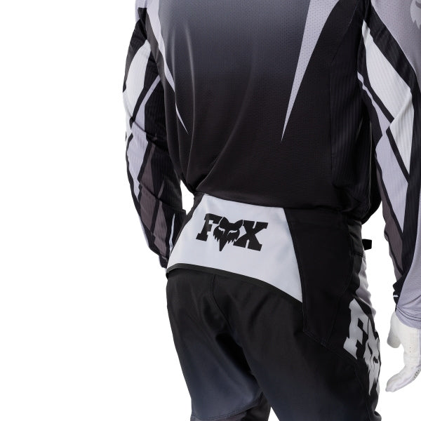 Fox Racing 360 Foundry Pants in Black/Grey, close-up of the ratcheting waist closure, with the ratcheting waist adjuster, stretch yoke, shaped hip panel, and reinforced knee or thigh material. Available options—Color: Black/Grey, Flo Red, Sky Blue, HiViz Yellow; Size: 28, 30, 32, 34, 36, 38. SKU 40695-014-34. UPC 198571123485.