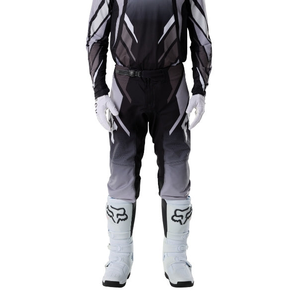 Fox Racing 360 Foundry Pants in Black/Grey, close-up of the side thigh and knee panels, with the ratcheting waist adjuster, stretch yoke, shaped hip panel, and reinforced knee or thigh material. Available options—Color: Black/Grey, Flo Red, Sky Blue, HiViz Yellow; Size: 28, 30, 32, 34, 36, 38. SKU 40695-014-36. UPC 198571123492.