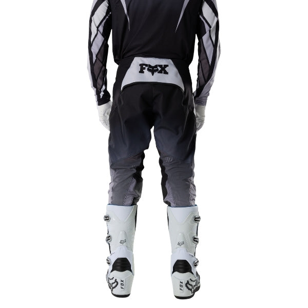 Fox Racing 360 Foundry Pants in Black/Grey, rear lower-leg and cuff view, with the reinforced seat, rear yoke, articulated knees, tapered legs, and lower-leg graphics. Available options—Color: Black/Grey, Flo Red, Sky Blue, HiViz Yellow; Size: 28, 30, 32, 34, 36, 38. SKU 40695-014-38. UPC 198571123508.