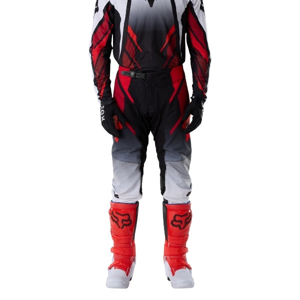Fox Racing 360 Foundry Pants in Flo Red, close-up of the side thigh and knee panels, with the ratcheting waist adjuster, stretch yoke, shaped hip panel, and reinforced knee or thigh material. Available options—Color: Black/Grey, Flo Red, Sky Blue, HiViz Yellow; Size: 28, 30, 32, 34, 36, 38. SKU 40695-110-36. UPC 198571125557.