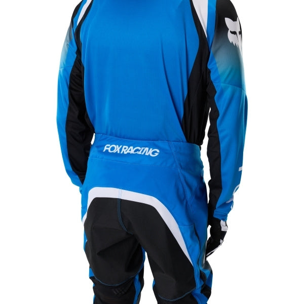 Fox Racing 180 Frame Pants in Blue, close-up of the ratcheting waist closure, with the ratcheting waist adjuster, stretch yoke, shaped hip panel, and reinforced knee or thigh material. Available options—Color: Blue, Grey/Yellow, Black, Red; Size: 26, 28, 30, 32, 34, 36, 38, 40, 42, 44. SKU 40696-002-32. UPC 198571123959.