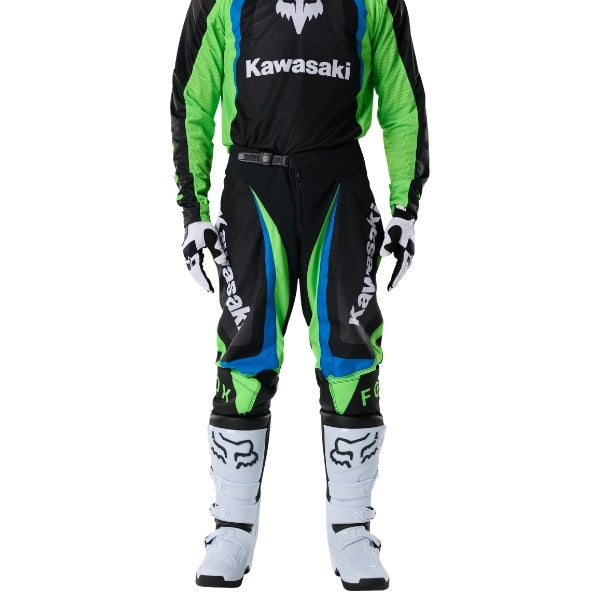 Fox Racing 180 Kawasaki Pants in Black, close-up of the side thigh and knee panels, with the ratcheting waist adjuster, stretch yoke, shaped hip panel, and reinforced knee or thigh material. Available options—Color: Black; Size: 26, 28, 30, 32, 34, 36, 38. SKU 40697-001-34. UPC 198571122068.