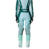 Fox Racing 180 Raid Pants (Womens) in Melon, close-up of the ratcheting waist closure, with the ratcheting waist adjuster, stretch yoke, shaped hip panel, and reinforced knee or thigh material. Available options—Color: Lavender Drift, Melon; Size: 2, 4, 6, 8, 10, 12, 14, 16. SKU 40700-413-8. UPC 198571127551.