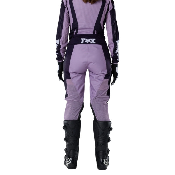 Fox Racing 180 Raid Pants (Womens) in Lavender Drift, rear lower-leg and cuff view, with the reinforced seat, rear yoke, articulated knees, tapered legs, and lower-leg graphics. Available options—Color: Lavender Drift, Melon; Size: 2, 4, 6, 8, 10, 12, 14, 16. SKU 40700-F07-12. UPC 198571126882.