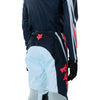 Fox Racing Flexair Arc Pants (Youth) in Ice Blue, close-up of the ratcheting waist closure, with the ratcheting waist adjuster, stretch yoke, shaped hip panel, and reinforced knee or thigh material. Available options—Color: Ice Blue, Chili; Size: Y-22, Y-24, Y-26, Y-28. SKU 40701-231-28. UPC 198571126622.