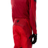 Fox Racing Flexair Arc Pants (Youth) in Chili, rear lower-leg and cuff view, with the reinforced seat, rear yoke, articulated knees, tapered legs, and lower-leg graphics. Available options—Color: Ice Blue, Chili; Size: Y-22, Y-24, Y-26, Y-28.