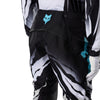 Fox Racing 360 Clutch Pants in White/Black, close-up of the ratcheting waist closure, with the ratcheting waist adjuster, stretch yoke, shaped hip panel, and reinforced knee or thigh material. Available options—Color: White/Black, Neon Pink; Size: 28, 30, 32, 34, 36, 38. SKU 40707-058-34. UPC 198571132579.