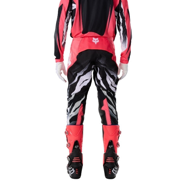 Fox Racing 360 Clutch Pants in Neon Pink, rear lower-leg and cuff view, with the reinforced seat, rear yoke, articulated knees, tapered legs, and lower-leg graphics. Available options—Color: White/Black, Neon Pink; Size: 28, 30, 32, 34, 36, 38. SKU 40707-065-38. UPC 198571128077.
