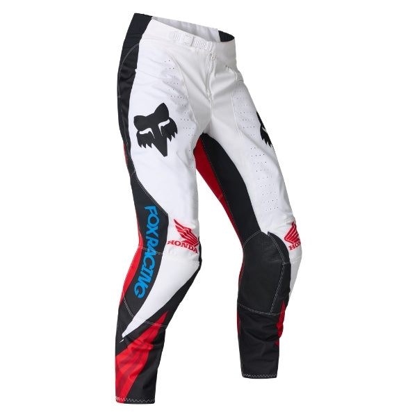 Fox Racing 180 Honda Pants in White/Red, front product view, with the adjustable waist, articulated knees, contrasting leg graphics, reinforced inner knees, and tapered cuffs. Available options—Color: White/Red; Size: 26, 28, 30, 32, 34, 36, 38. SKU 40708-077-26. UPC 198571132777.
