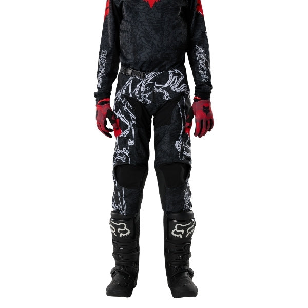Fox Racing 180 Abyss Pants (Youth) in Black, close-up of the side thigh and knee panels, with the ratcheting waist adjuster, stretch yoke, shaped hip panel, and reinforced knee or thigh material. Available options—Color: Black; Size: Y-22, Y-24, Y-26, Y-28.