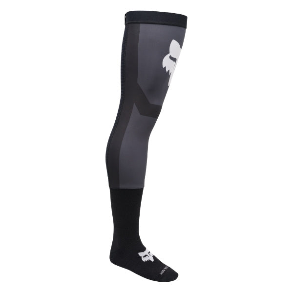 Fox Racing Flexair Knee Brace Socks in Black, full-length side view, with the ribbed cuff, knitted Fox graphics, shaped heel, reinforced toe, and ventilated stretch knit. Available options—Color: Black, Blue, Red, Grey; Size: MD, LG. SKU 40714-001-M. UPC 198571122396.