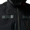 Leatt Moto 6.5 HydraDri Jacket in Black, close-up of the upper chest zipper and feature labels