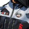 Leatt Moto 5.5 Enduro Jacket in Camo Grey, worn by a rider, showing the fit and front storage pockets