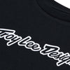 Professional studio photo of Troy Lee Designs Signature Tee (Womens); showing tee fit, printed graphics, and crew neckline; SKU 7539170; Sizes: S-XL