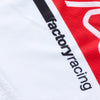 Close-up of the sleeve of a Troy Lee Designs GP Pro jersey in White/Red, highlighting the 'factory racing' text graphic. SKU: 377262022 | SKU:  | Available at BTO Sports