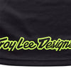 Detail of the lower back hem of the black Troy Lee Designs Scout GP Pro jersey, showing the neon yellow 