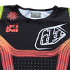 A close-up shot of the collar and neck area of the Troy Lee Designs SE PRO JERSEY in black/multi. The collar is a soft, black V-neck. The vibrant 