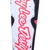 A close-up of a white and infrared motocross jersey sleeve. The white fabric is covered in a black splatter pattern and a large, bright red 