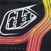 A front-side view of the Troy Lee Designs SE Pro Stripes jersey, showcasing the vibrant multi-colored striped graphic that fades into black. | SKU:  | Available at BTO Sports