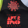 Detail of the 'ENJOYTHERIDE' and 'ART & SPEED CREATIONS' graphics on the lower front of a Troy Lee Designs SE PRO Jersey Stipes Multi Color sku 393260001 | SKU:  | Available at BTO Sports