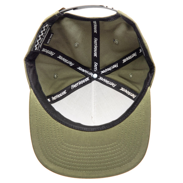 SKU 3210050 – Inside view of Fasthouse Spanner Hat, olive green with black interior seam tape featuring repeated Fasthouse branding, structured crown with ventilation eyelets, designed for motocross lifestyle comfort.