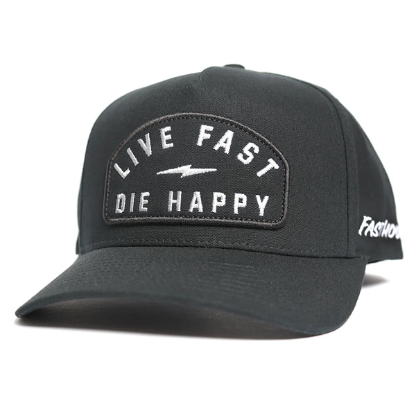 Fasthouse WIRED Hat in black (SKU 3297960500) angled front view showing curved bill and embroidered patch reading “Live Fast Die Happy” with lightning bolt, motocross lifestyle snapback cap.