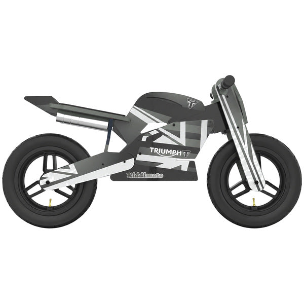 Kiddimoto Triumph Daytona 765 wooden balance bike in a side view, with a black-and-white racing frame, black wheels and tires, black seat and grips and prominent Triumph and Moto2-style graphics. SKU 6393000350, UPC 5060840317985.
