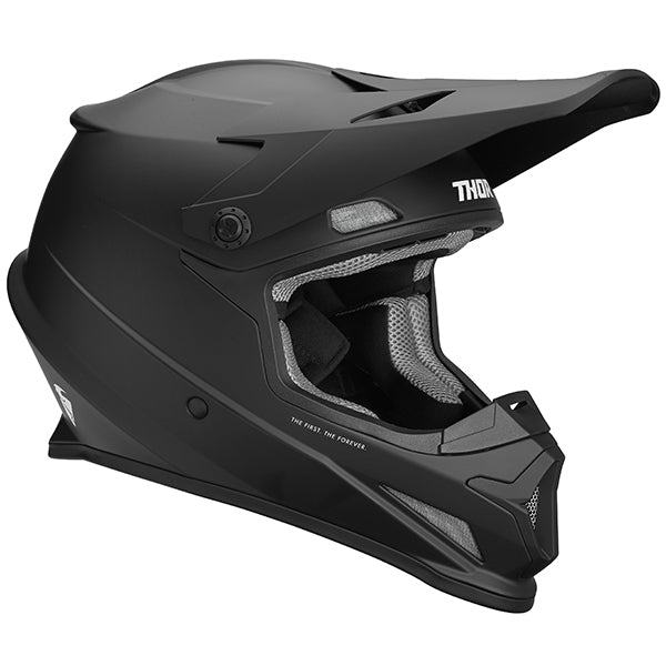 Studio view of Thor Thor - Sector Solid Helmet helmet, in Black, vented chin bar and intake ports, on a clean white background, for motocross / off-road use, (SKU 011055) Colors: Black Sizes: 2X, LG, MD, SM, XL, XS